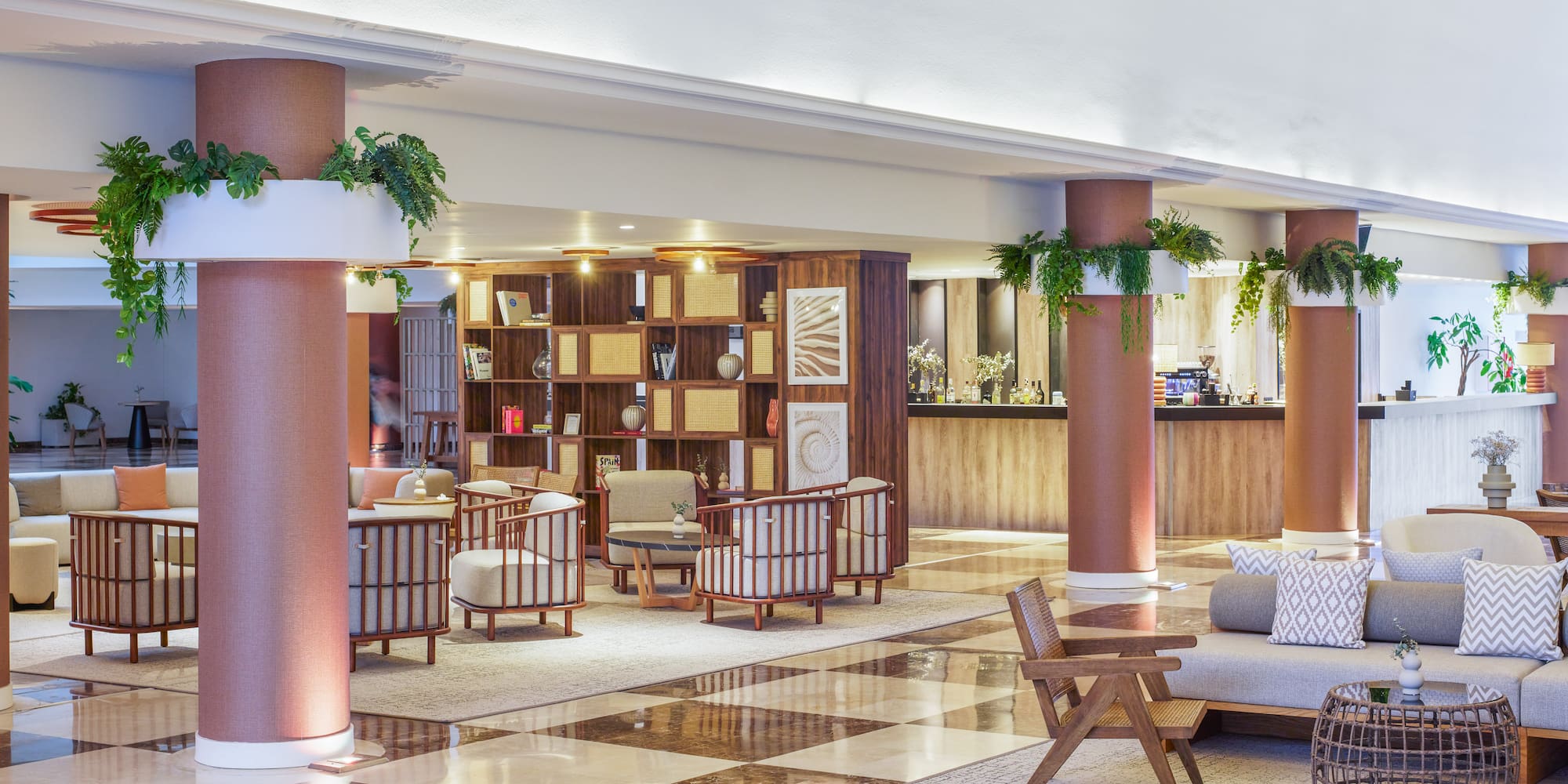 a large room with a checkered floor and a couch and chairs