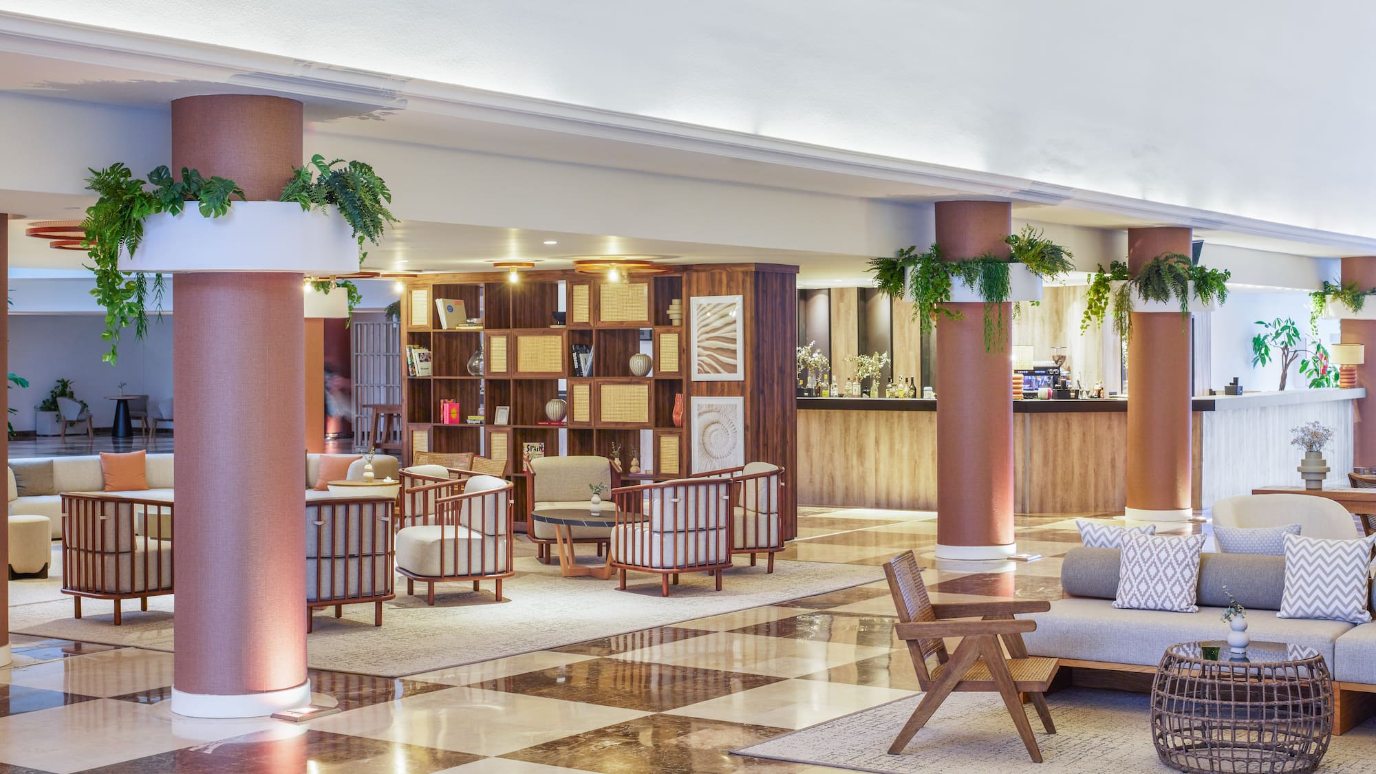 a large room with a checkered floor and a couch and chairs