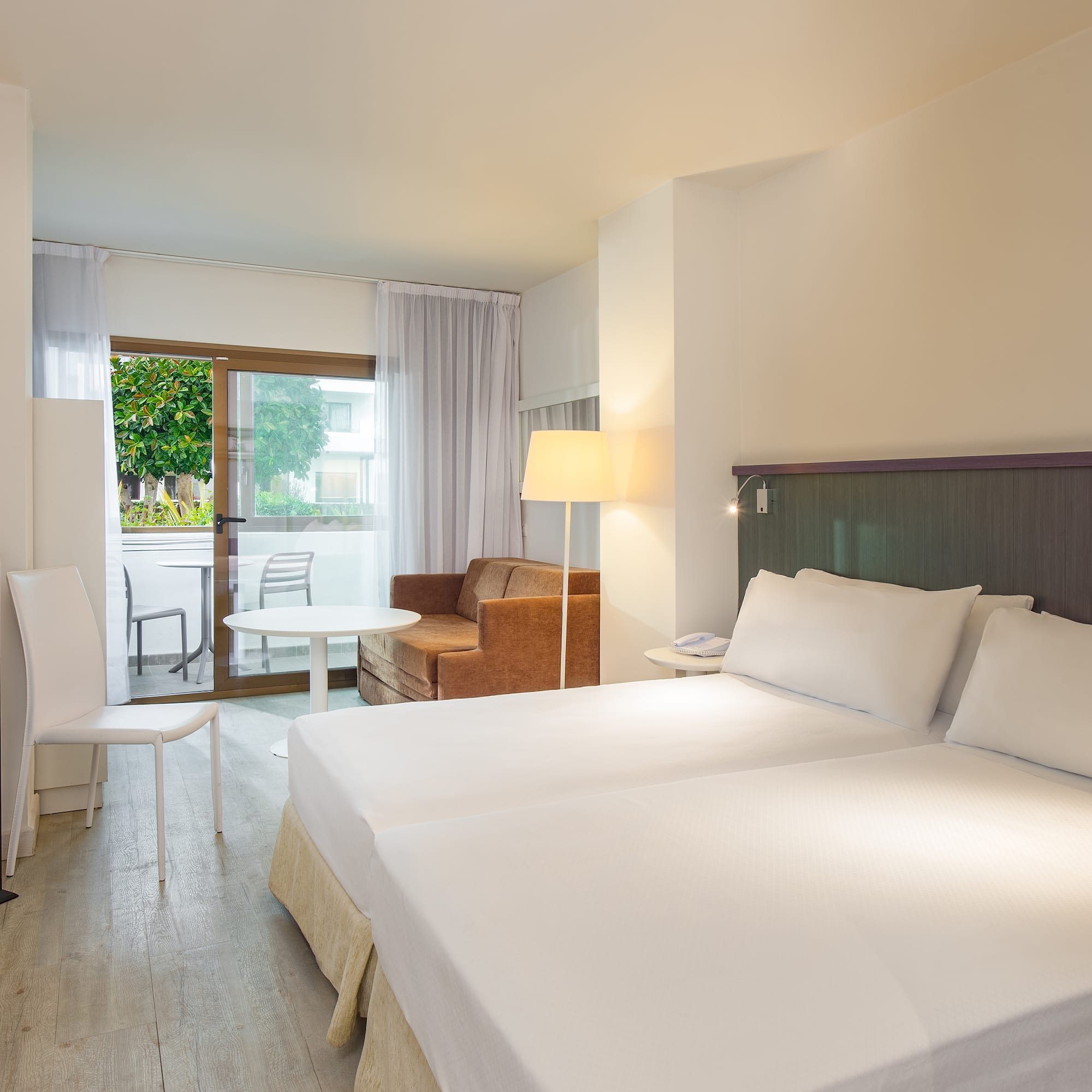 a room with two beds and a table