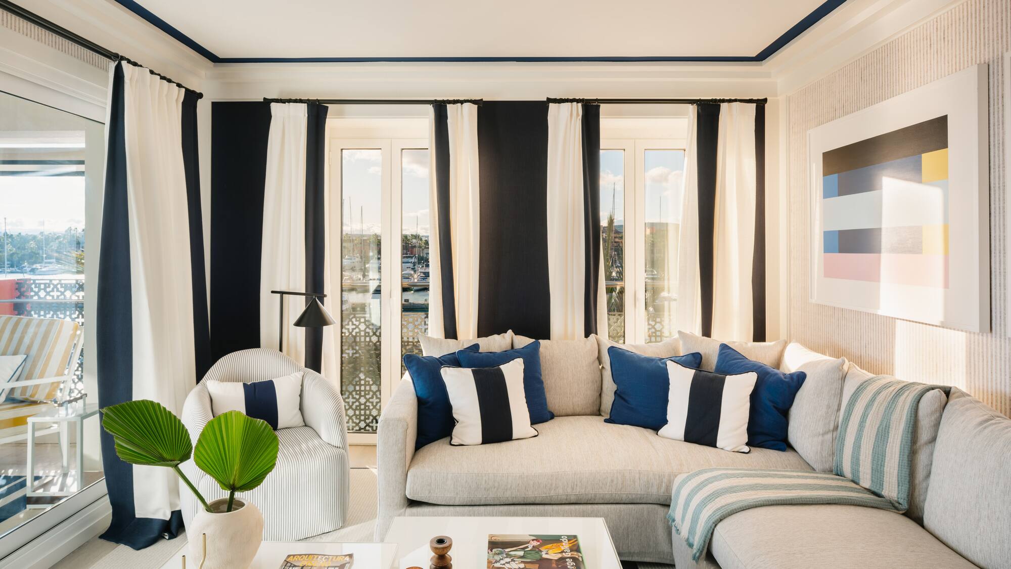 a living room with a couch and chairs