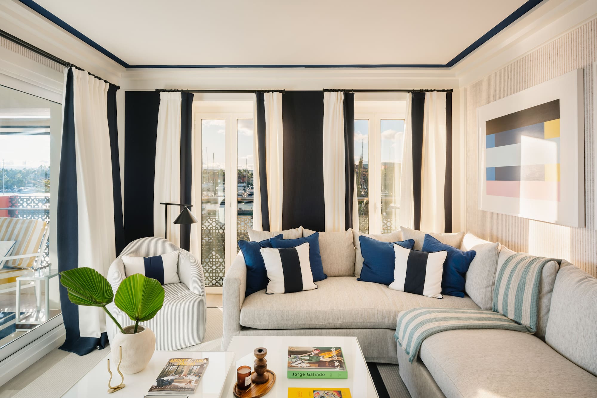 a living room with a couch and chairs