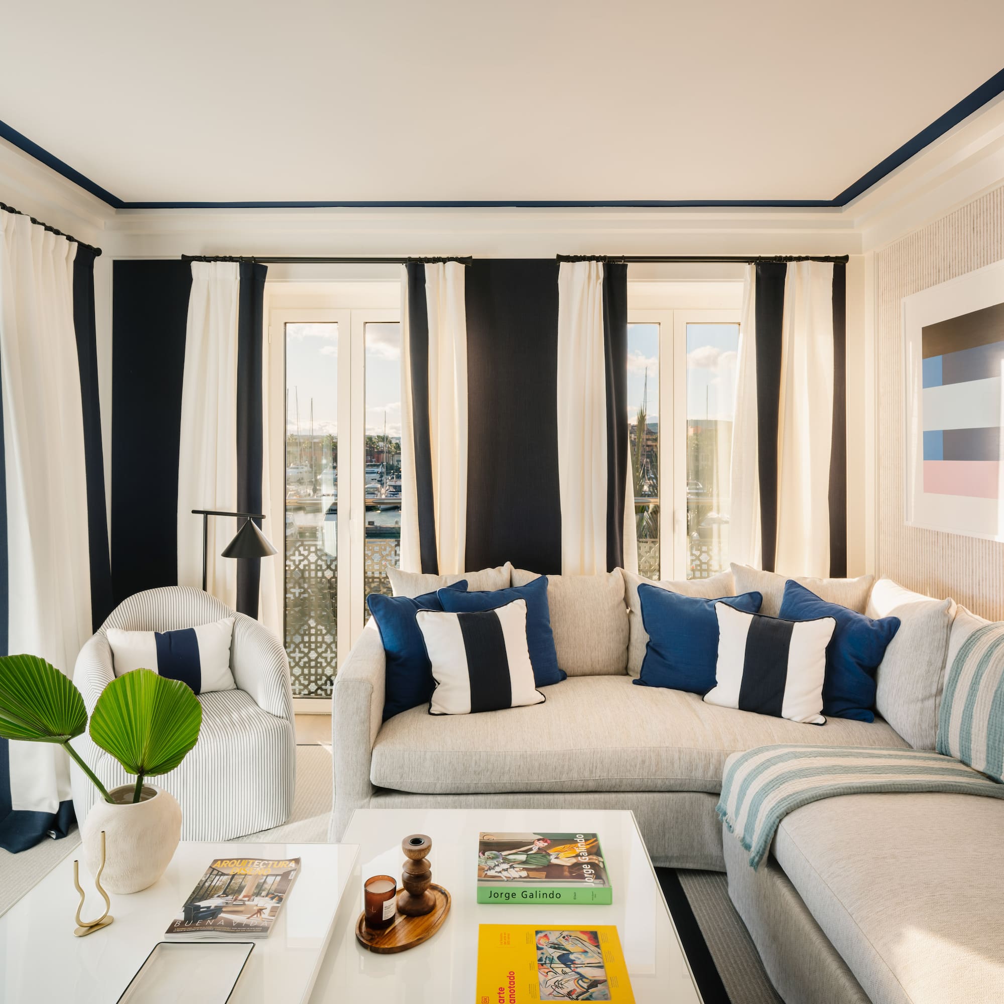 a living room with a couch and chairs