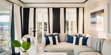 a living room with a couch and chairs