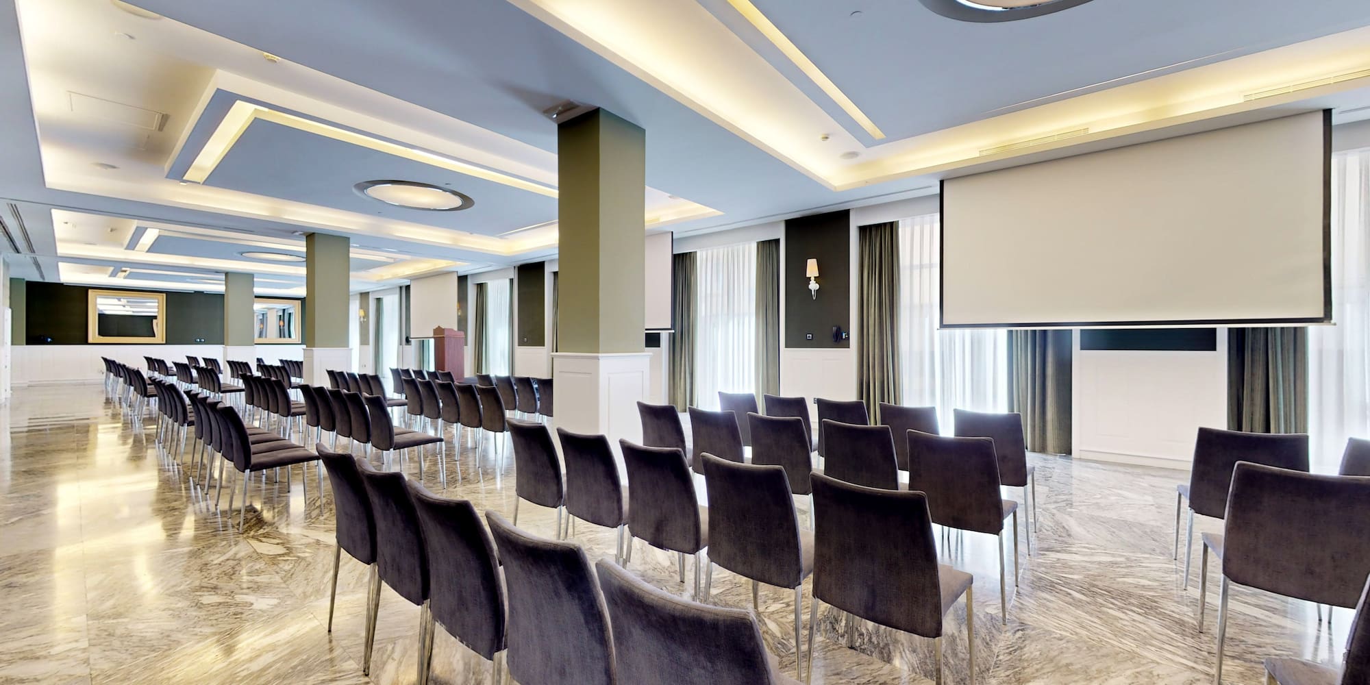 a room with chairs and a podium