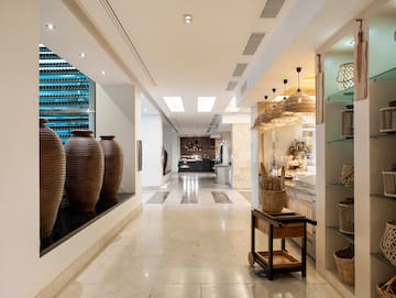 a large vases on a shelf in a store