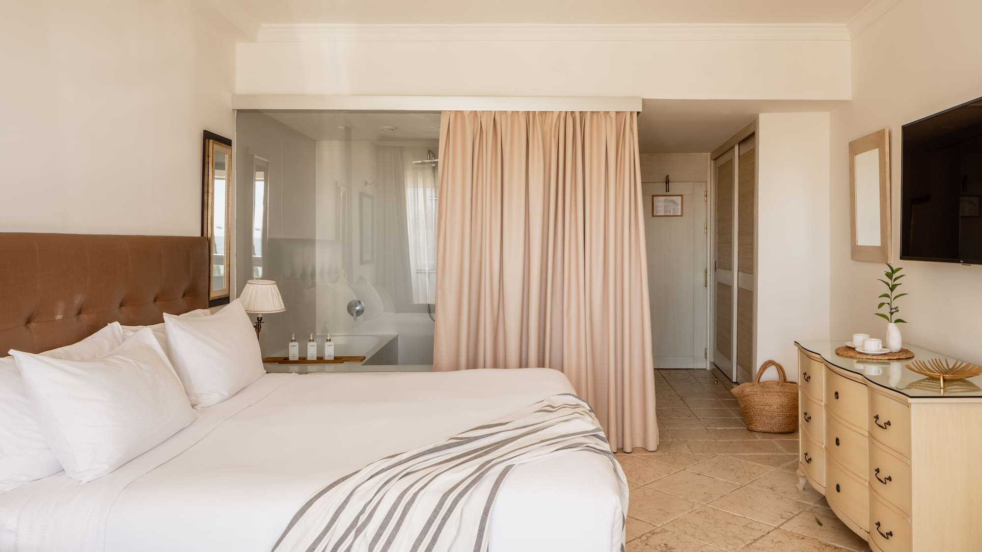 a bed with a curtain in a room