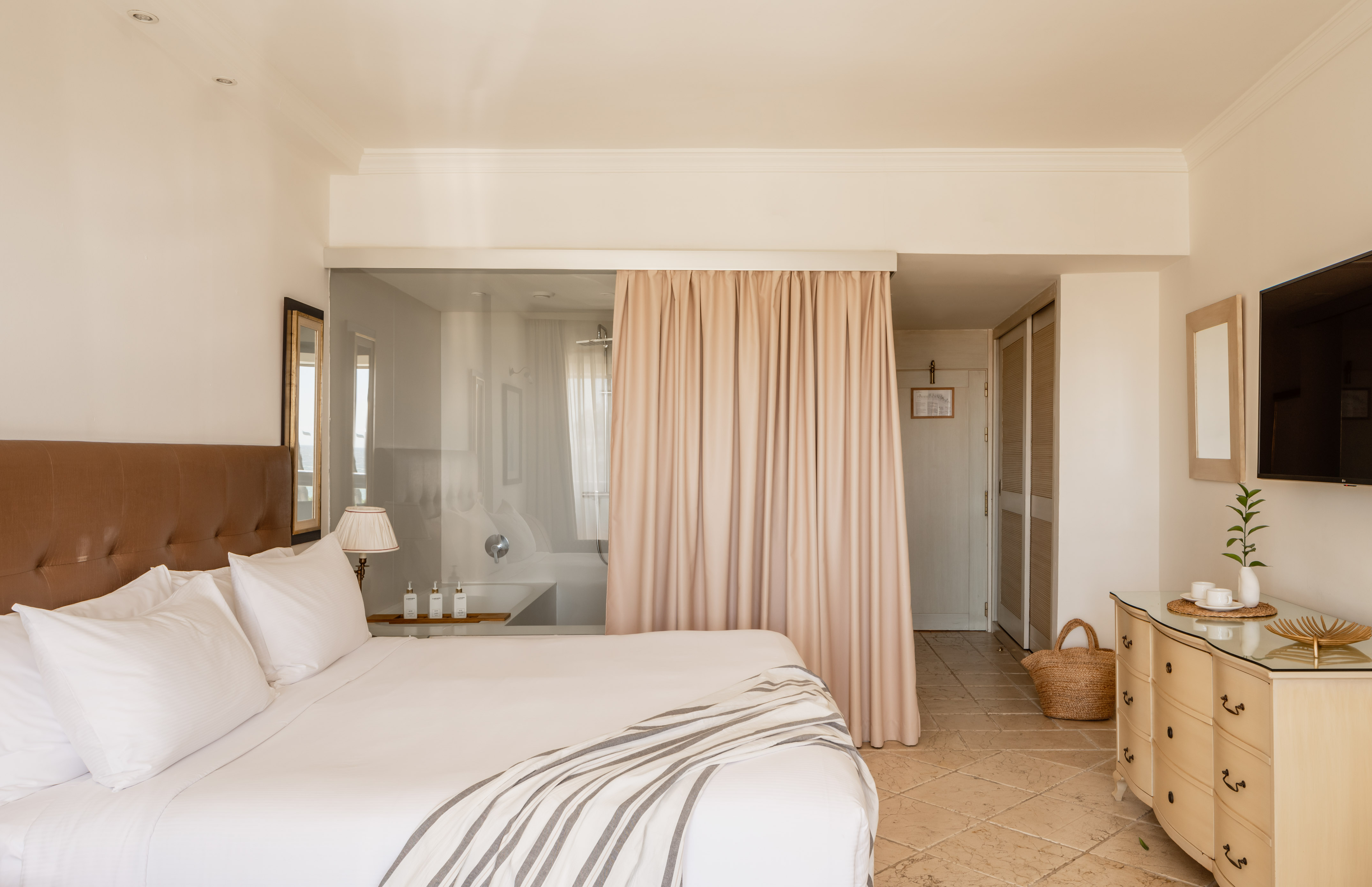 a bed with a curtain in a room