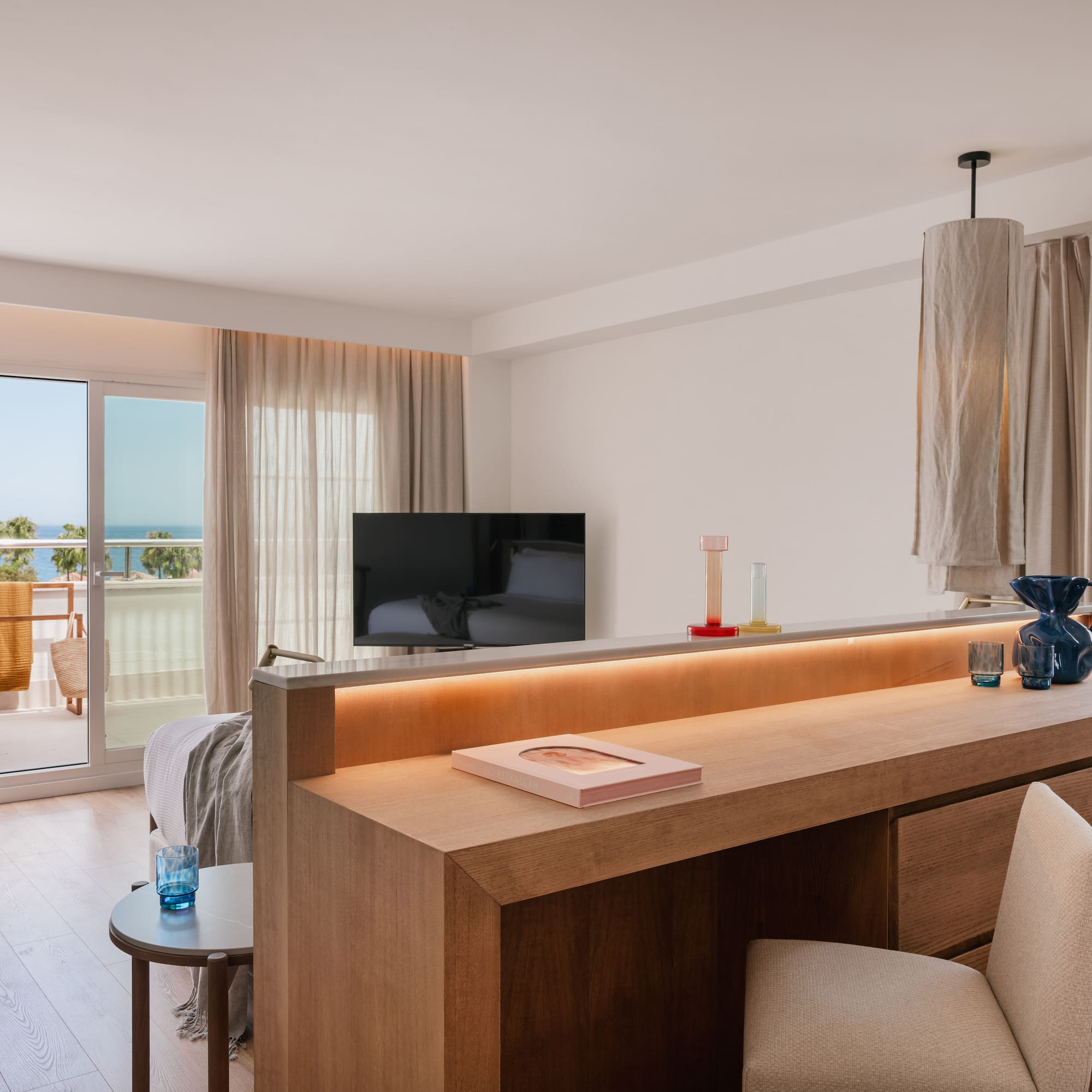 a room with a television and a balcony