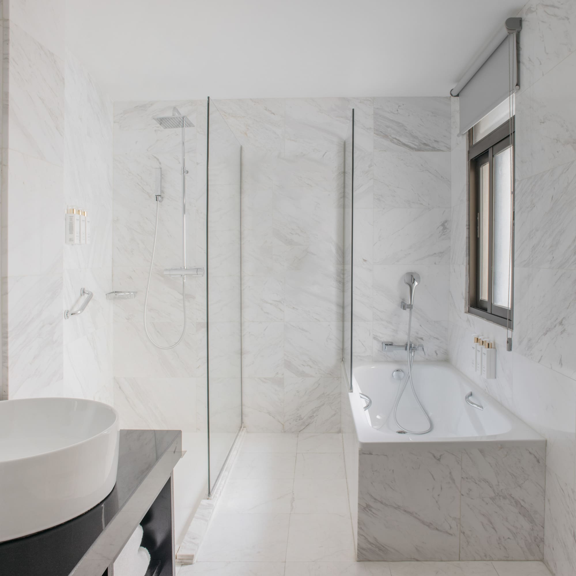 a bathroom with a tub and shower