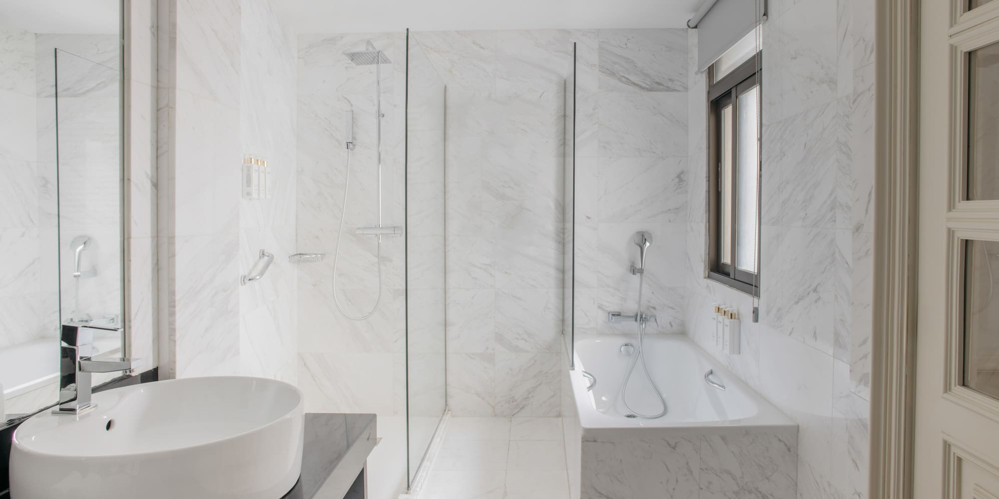 a bathroom with a tub and shower