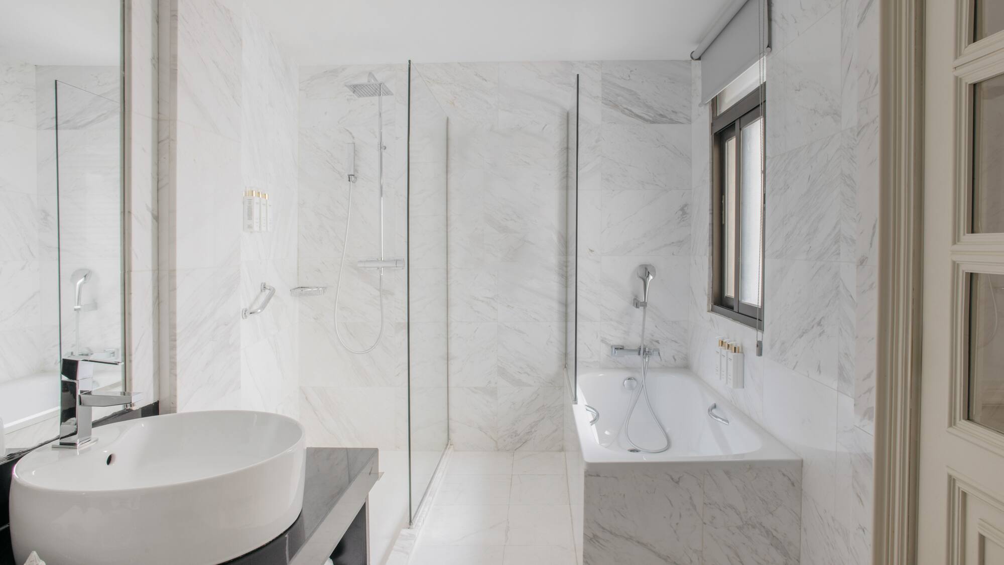 a bathroom with a tub and shower