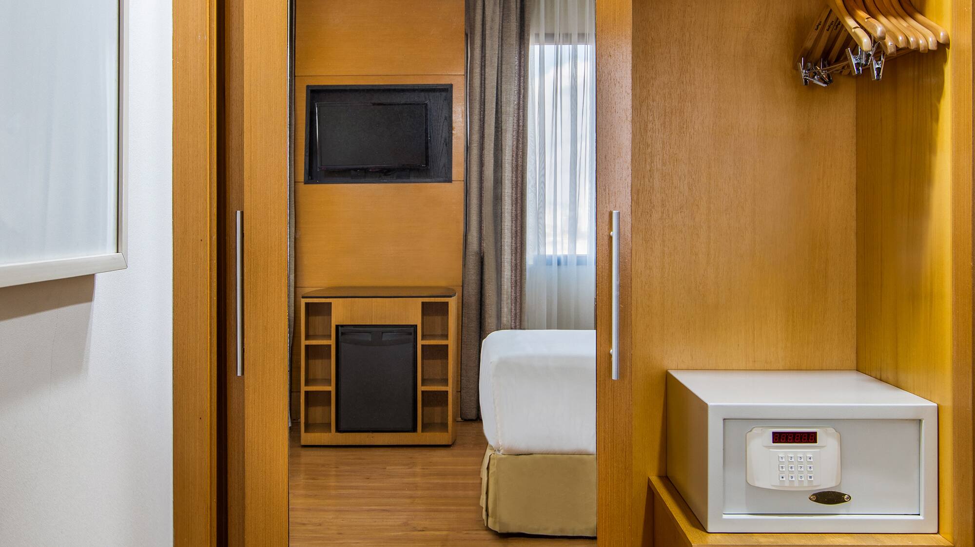 a closet with a door open