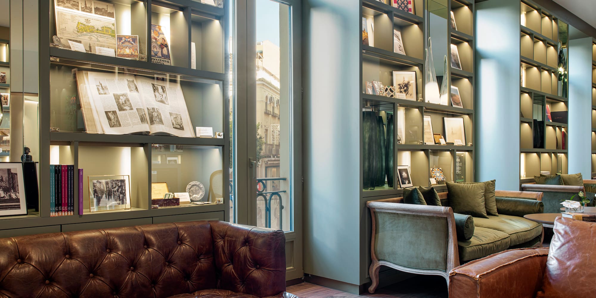 a room with a couch and a bookcase