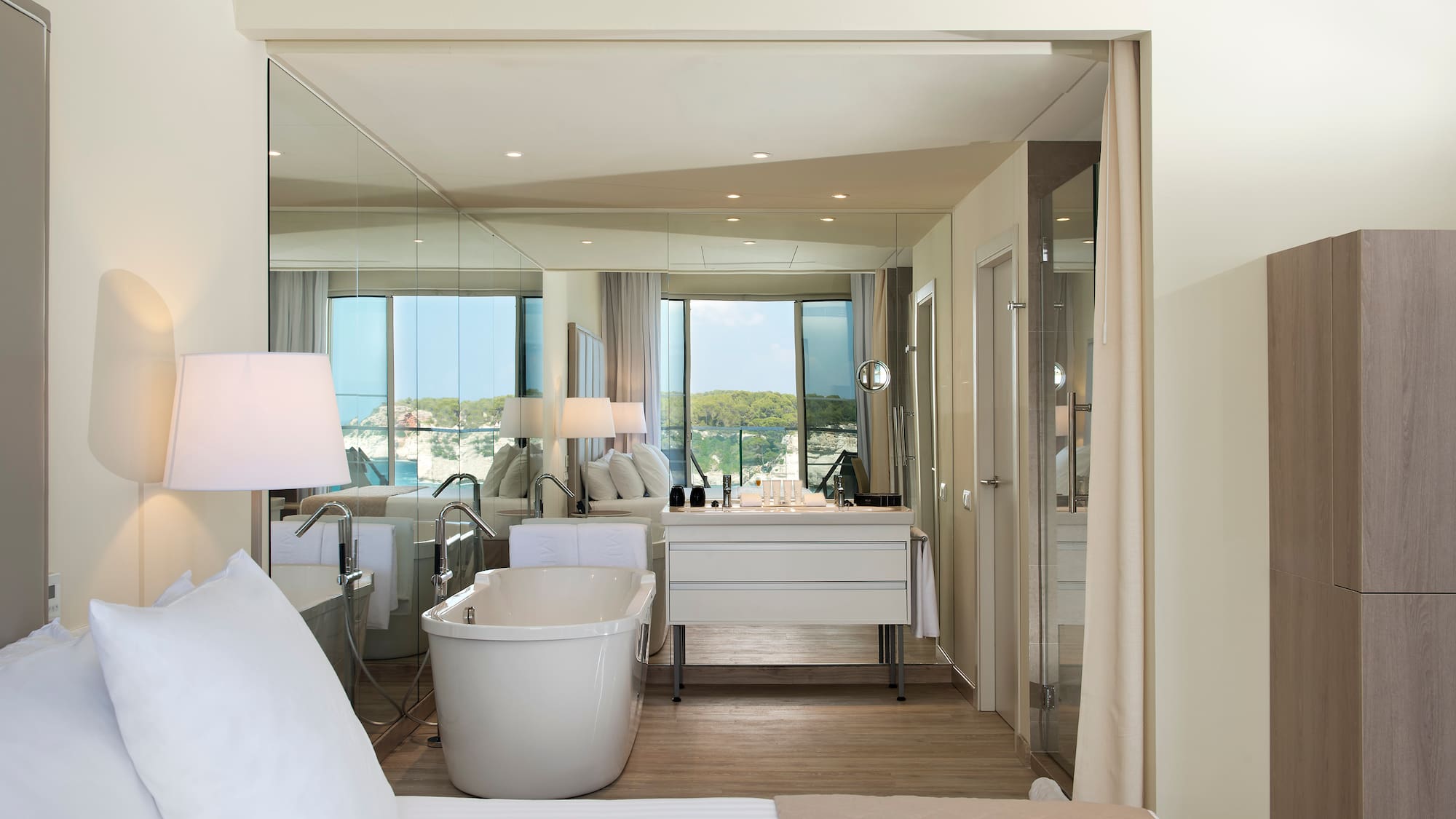 a room with a bathtub and a mirror