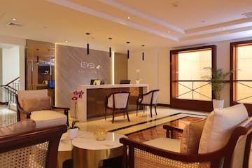 a lobby with a reception desk and chairs