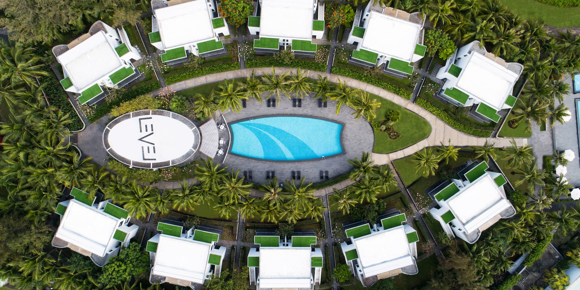a pool in a circle with buildings around it