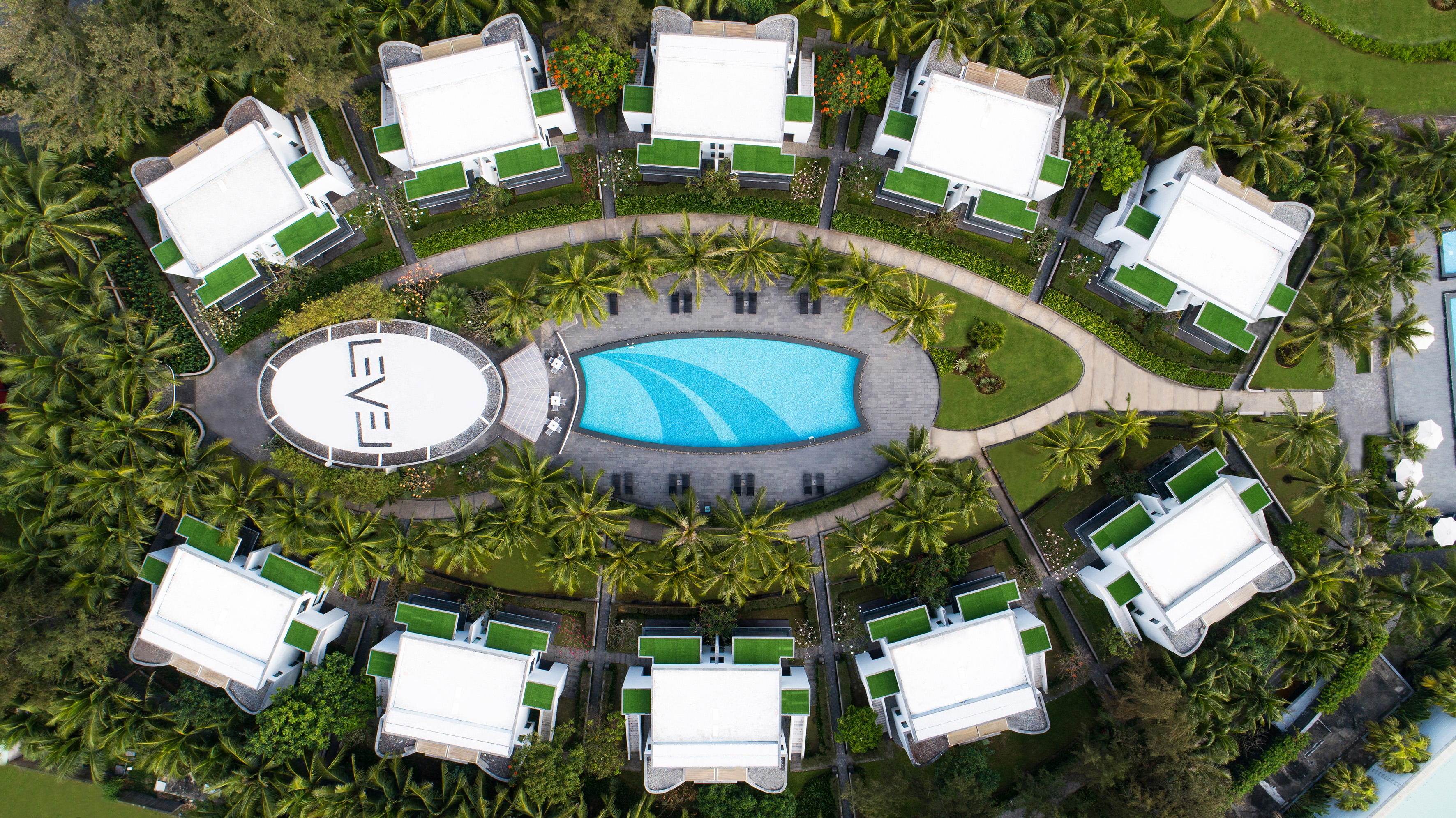 a pool in a circle with buildings around it