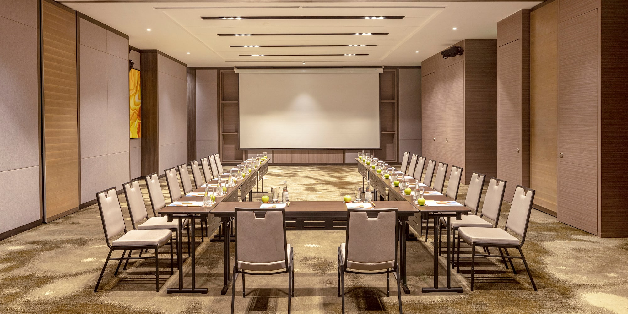 a room with a large table and chairs