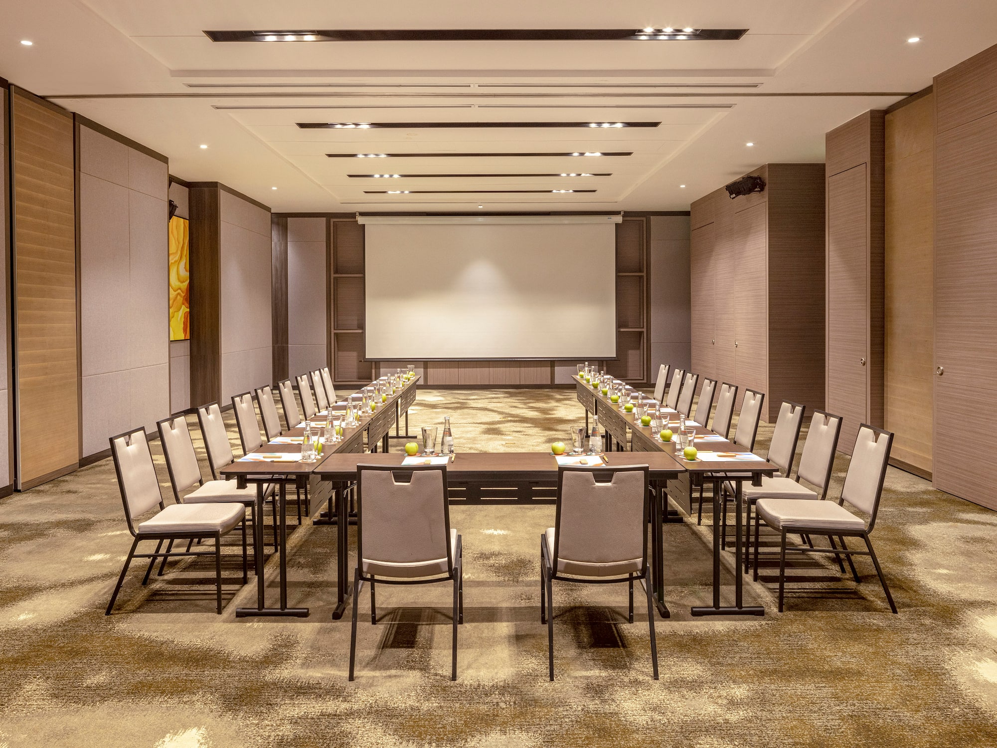 a room with a large table and chairs