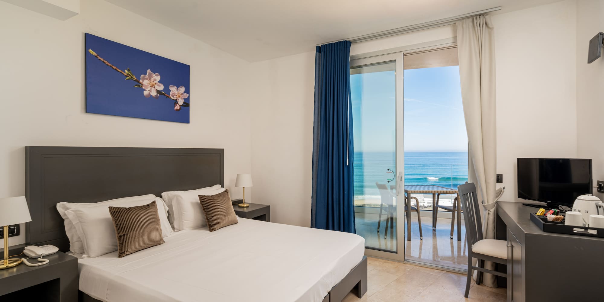 a bedroom with a glass door and a bed