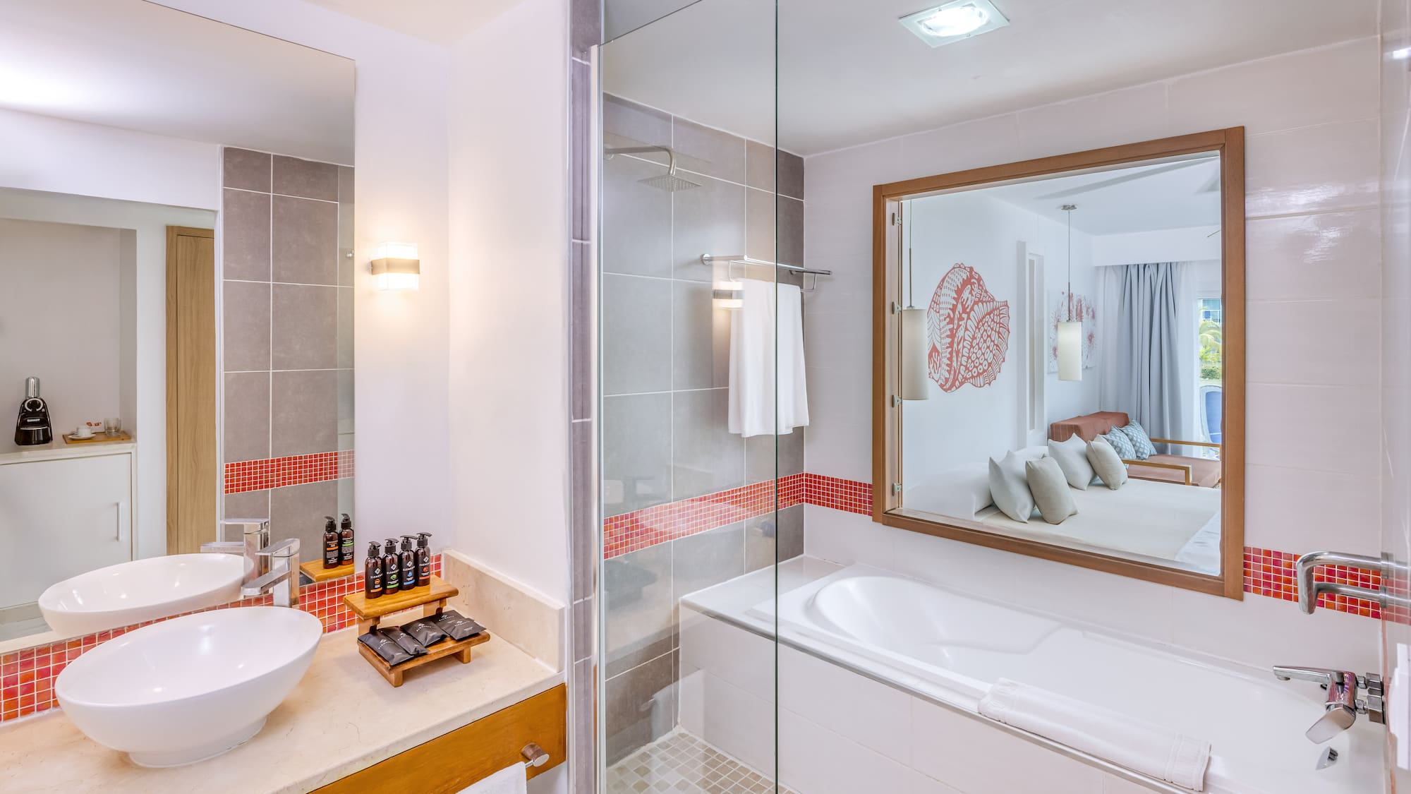 a bathroom with a glass shower and a sink