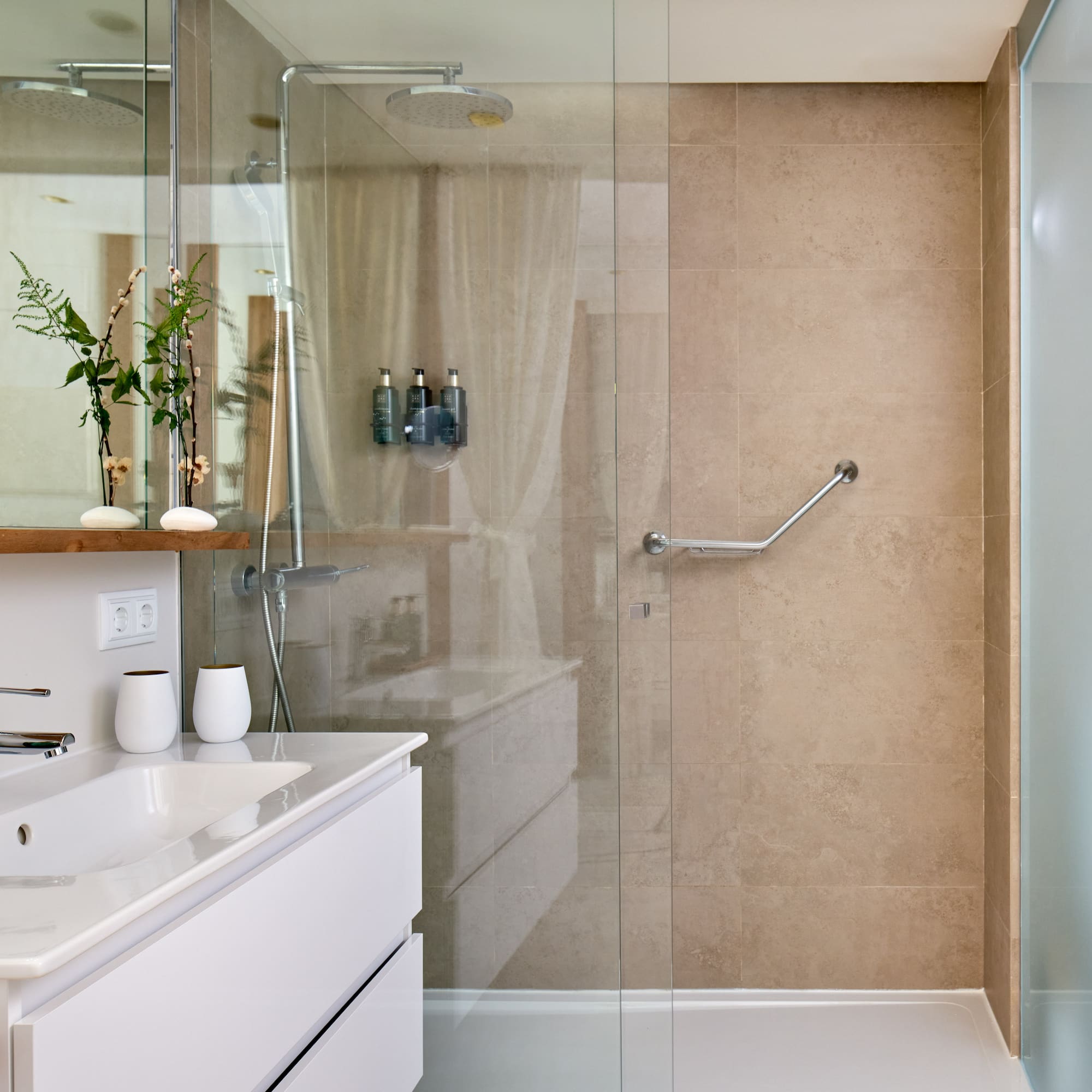 a bathroom with a glass shower door