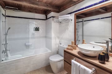 a bathroom with a sink toilet and bathtub