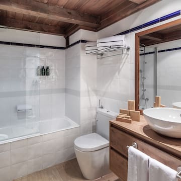 a bathroom with a sink toilet and bathtub