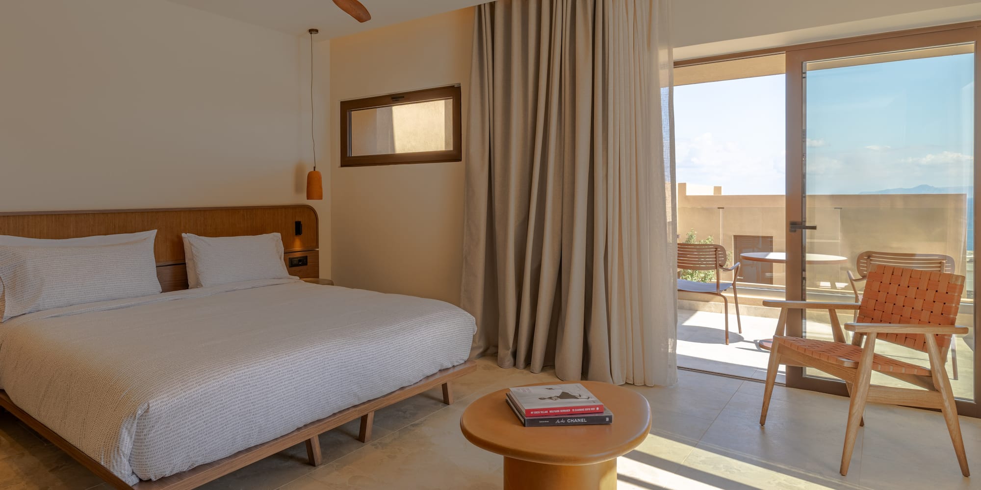 a bedroom with a bed and a table