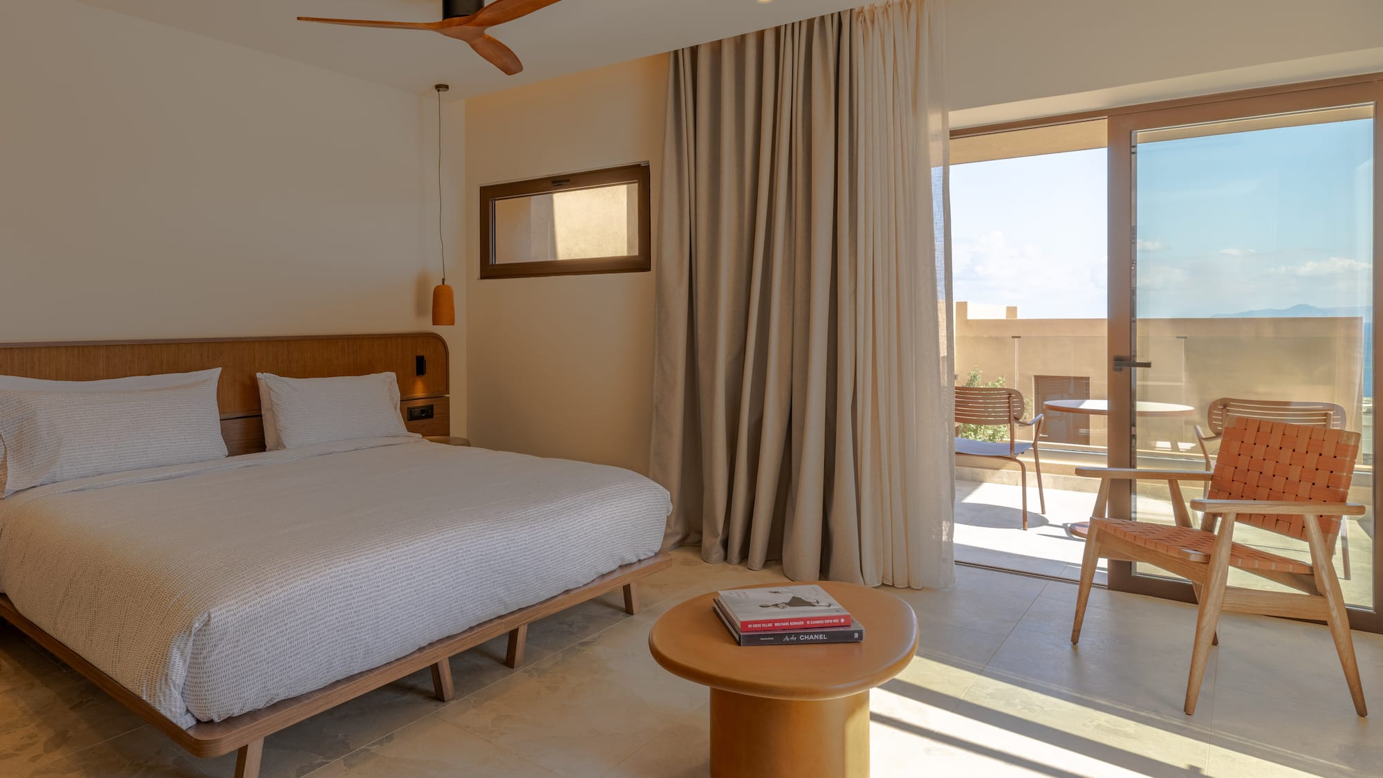 a bedroom with a bed and a table