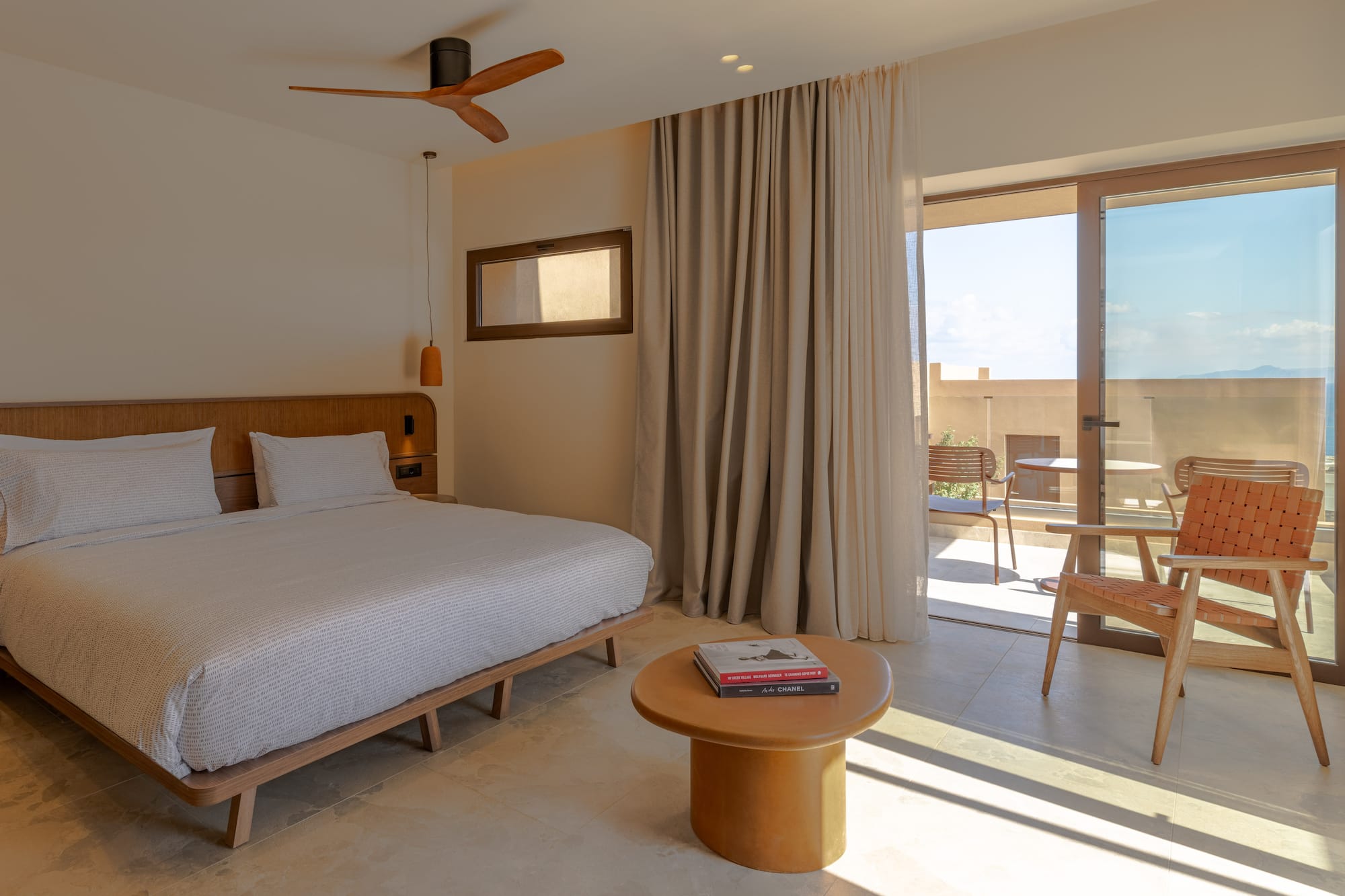 a bedroom with a bed and a table