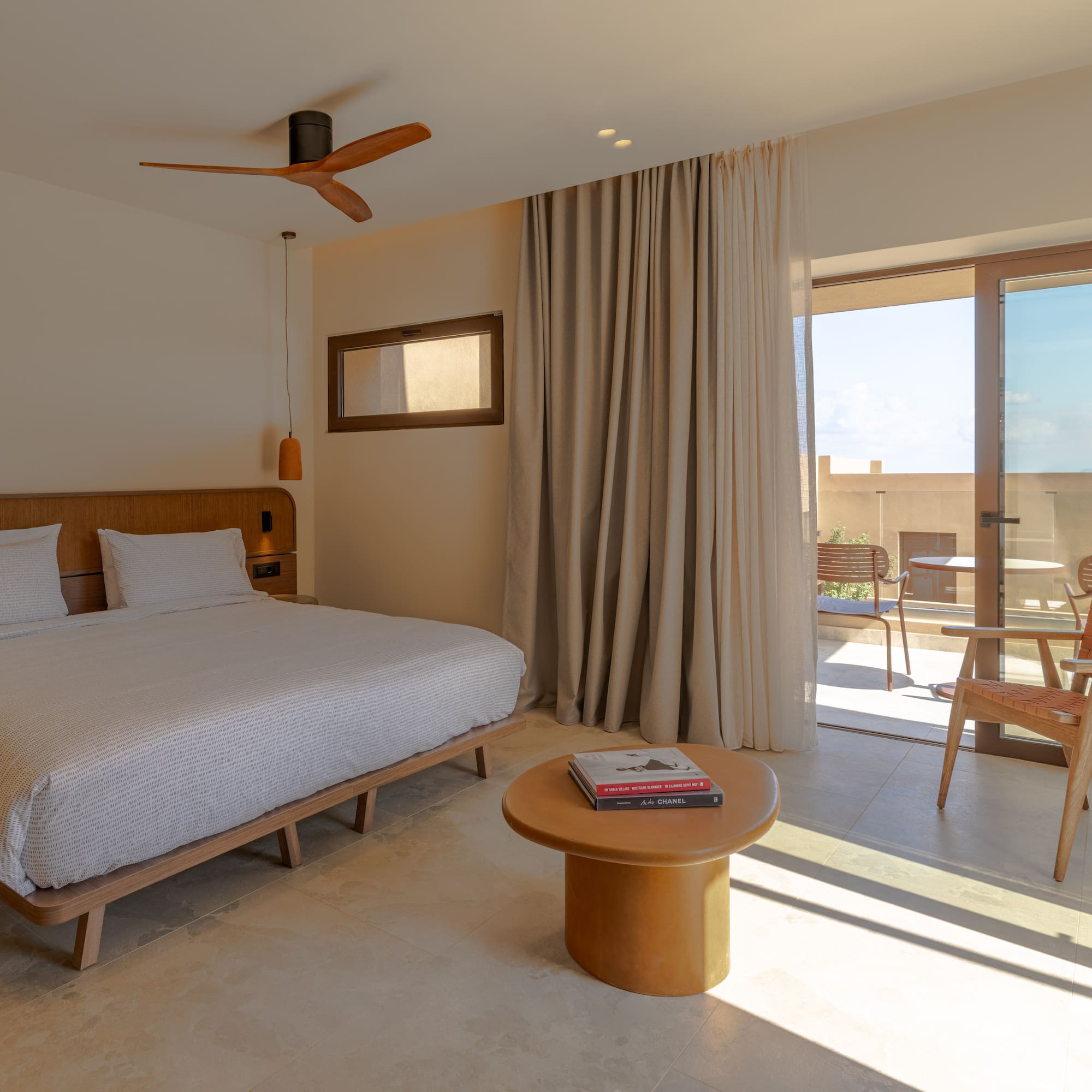 a bedroom with a bed and a table