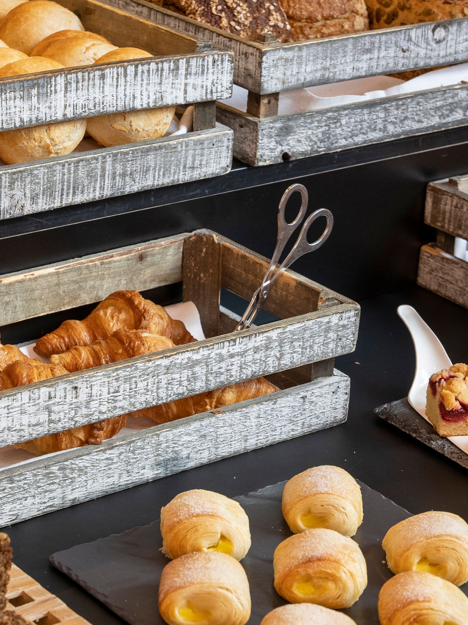 a variety of breads in wooden crates