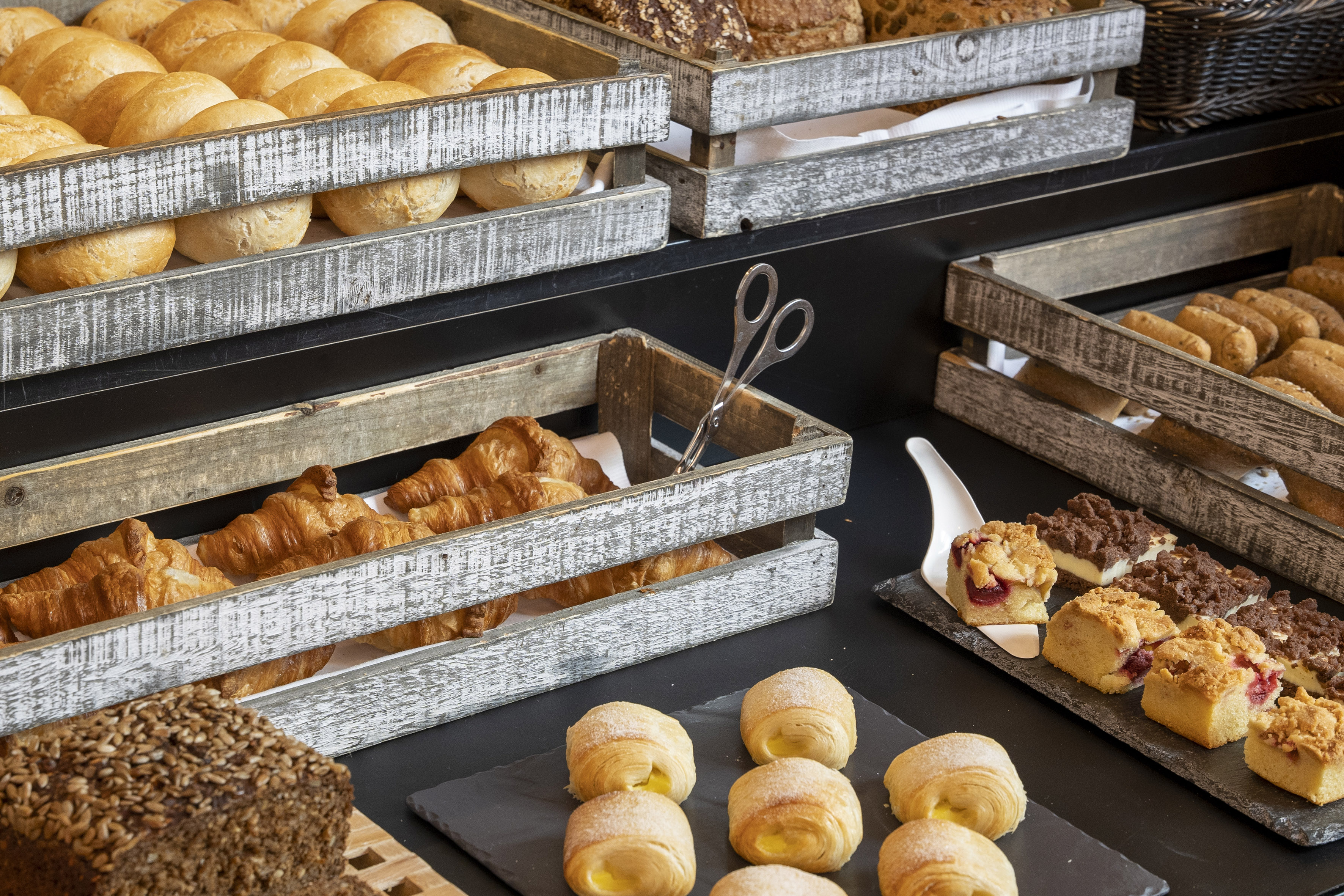 a variety of breads in wooden crates