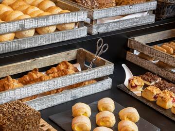 a variety of breads in wooden crates