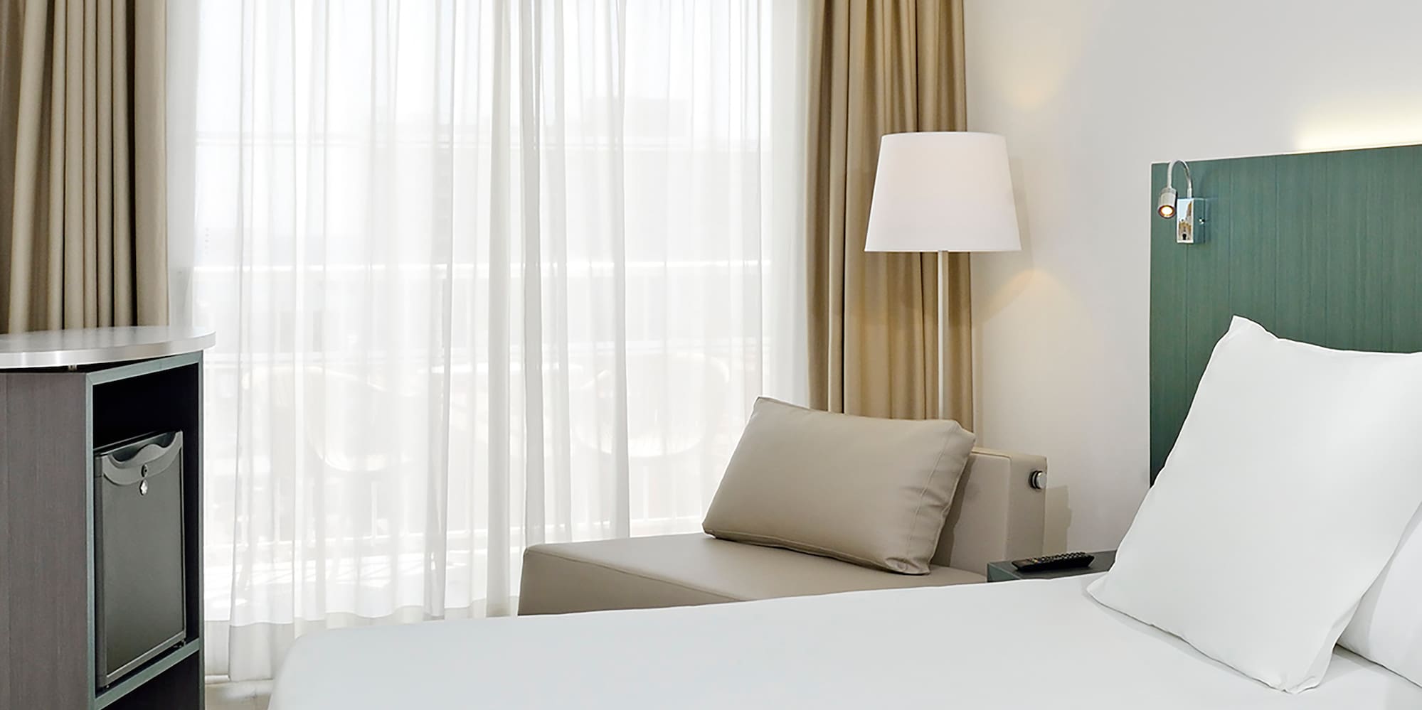 a room with two beds and a table