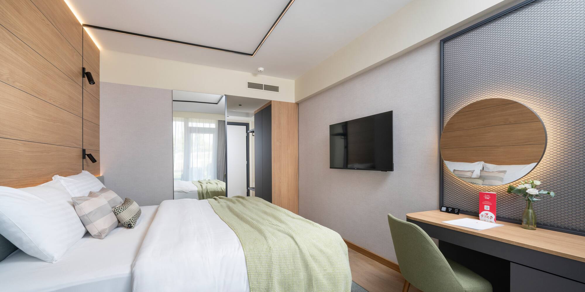 a room with a bed and a desk