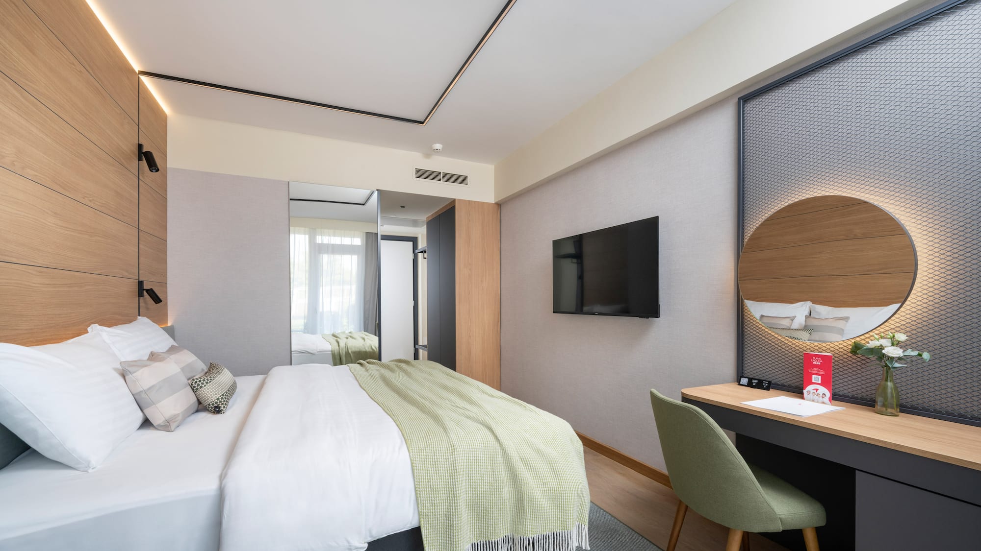 a room with a bed and a desk