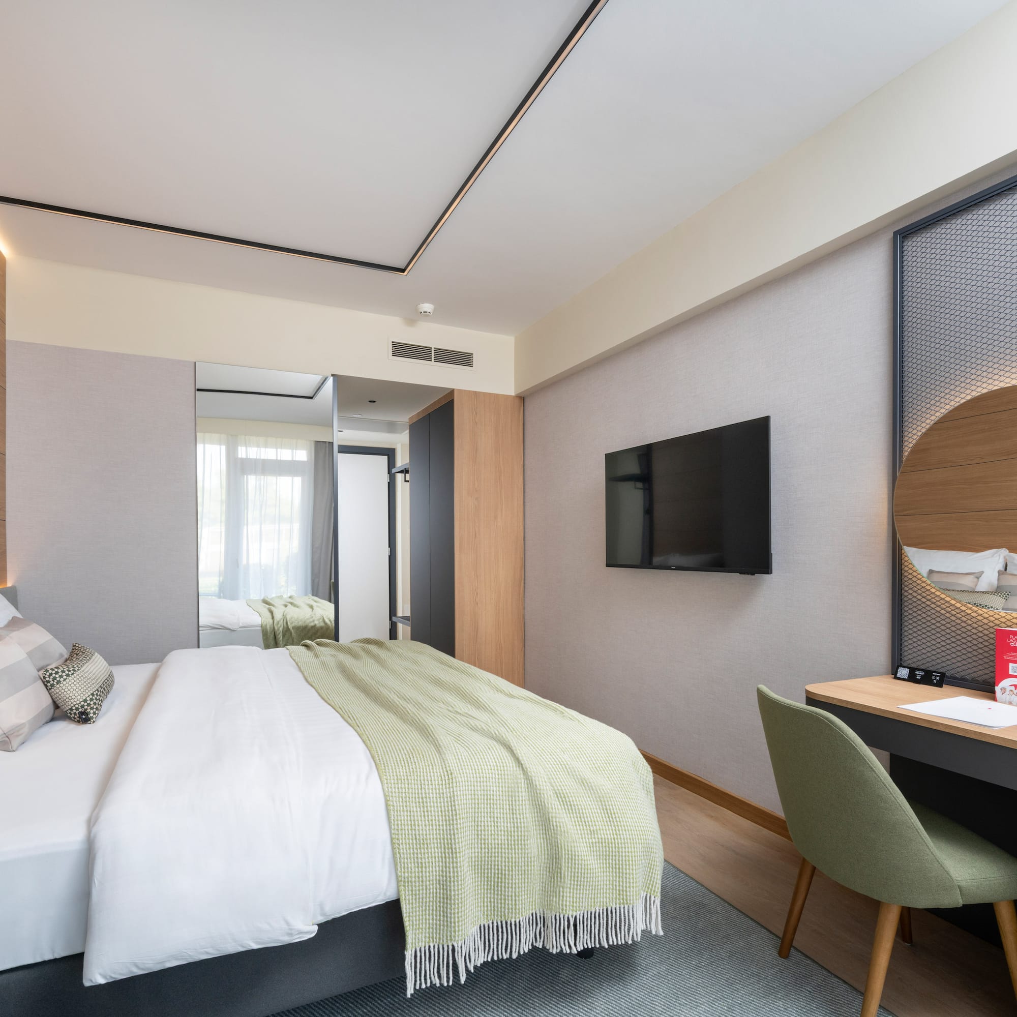 a room with a bed and a desk