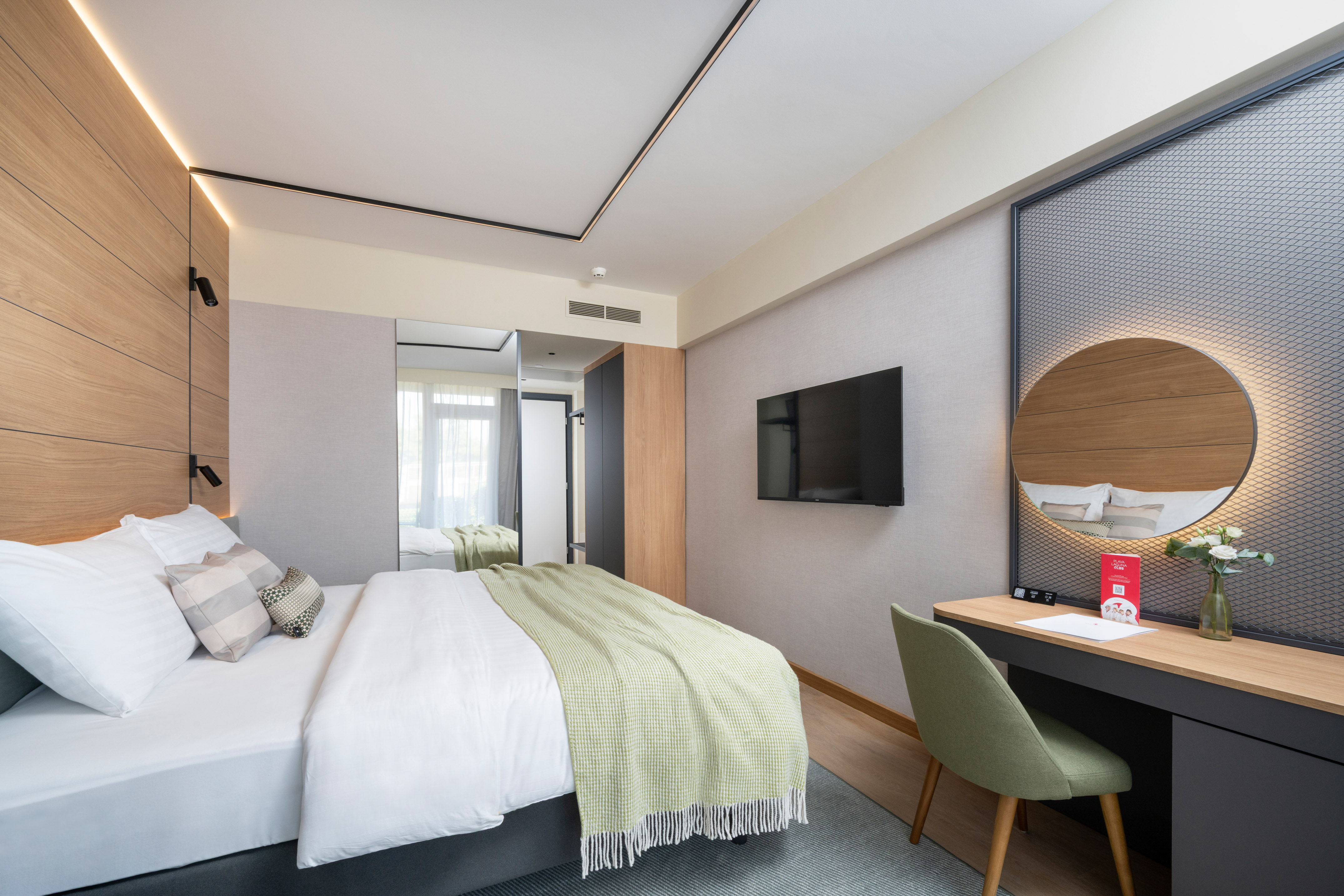 a room with a bed and a desk