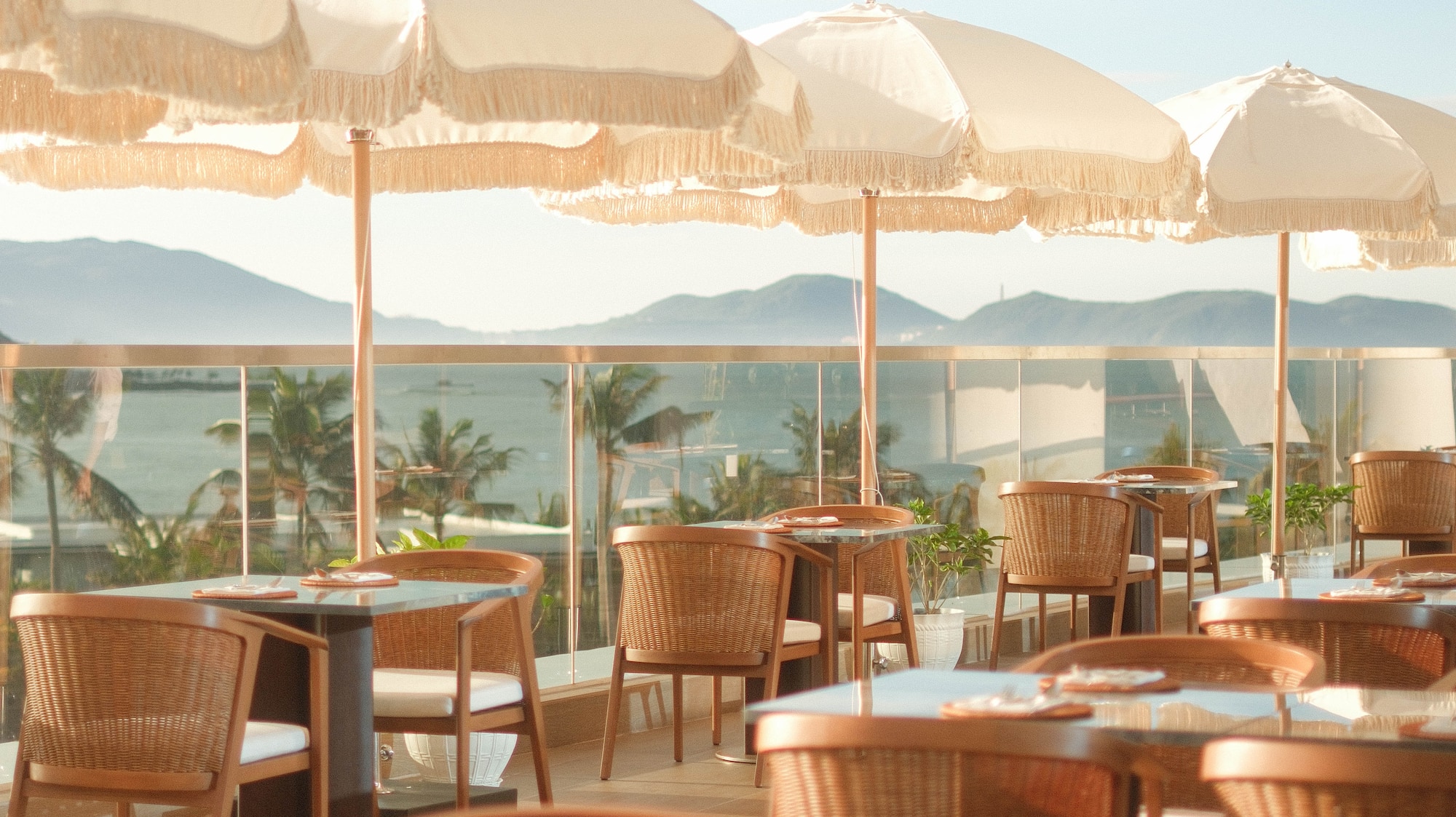 a table and chairs with umbrellas