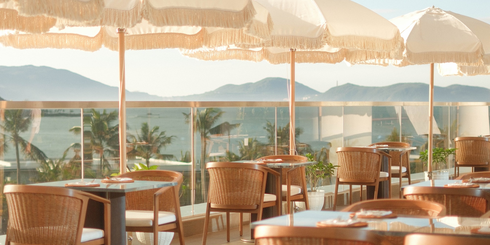 a table and chairs with umbrellas