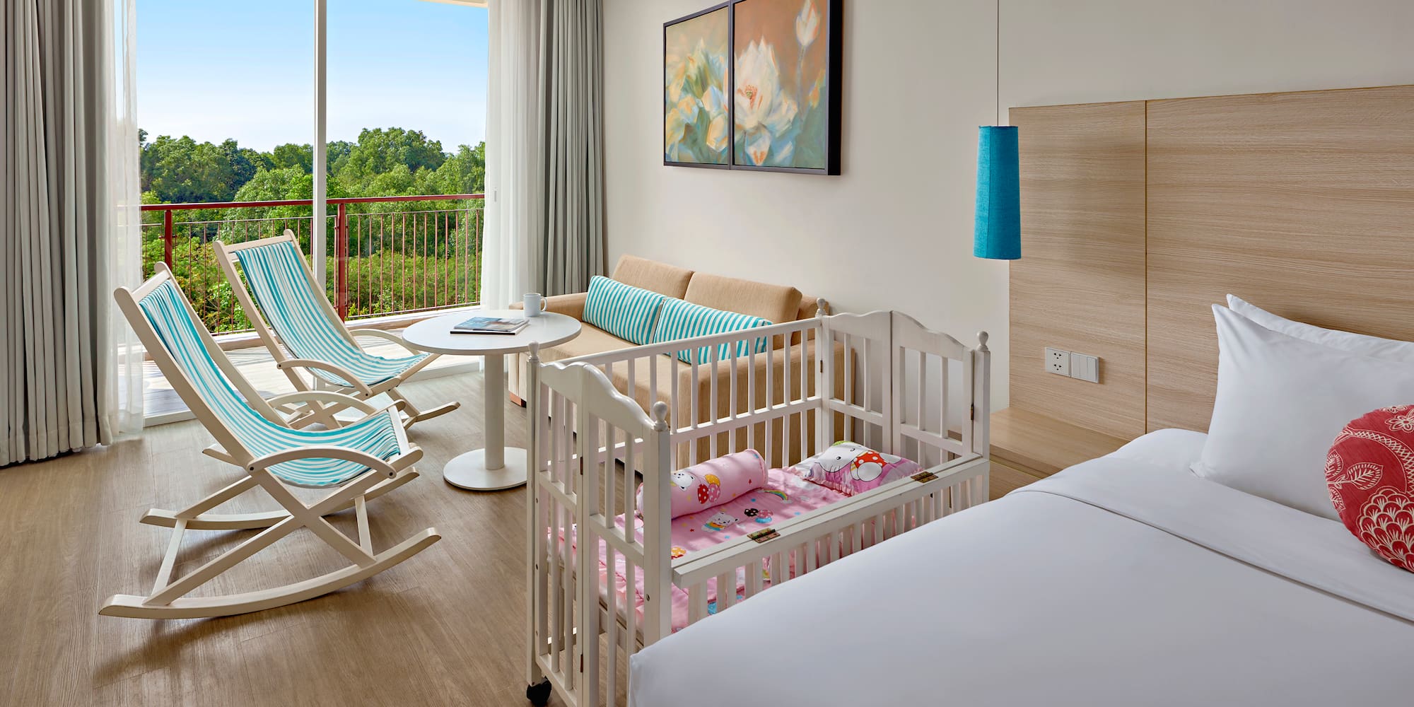 a room with cribs and chairs