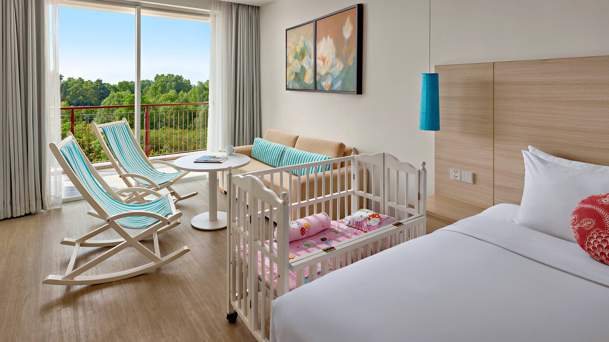 a room with cribs and chairs