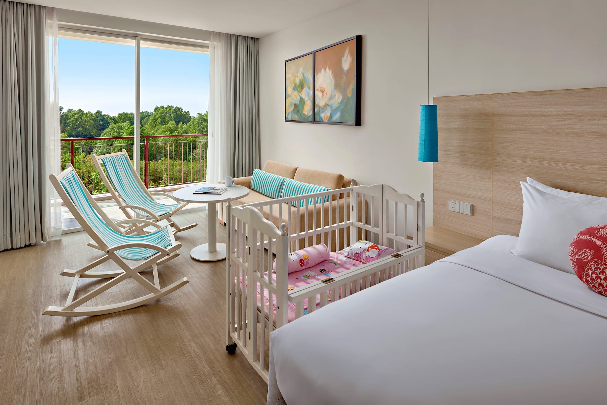 a room with cribs and chairs