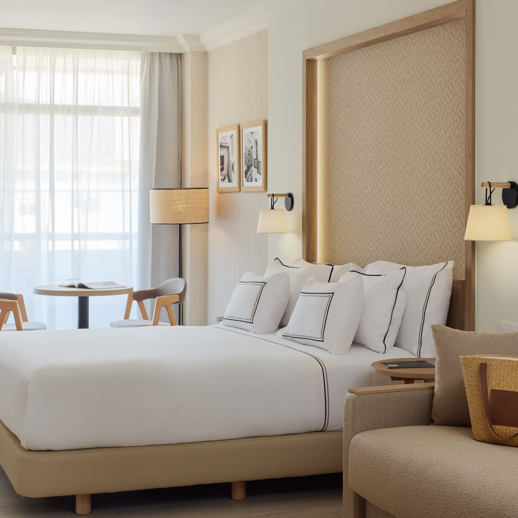 a hotel room with a bed and a chair