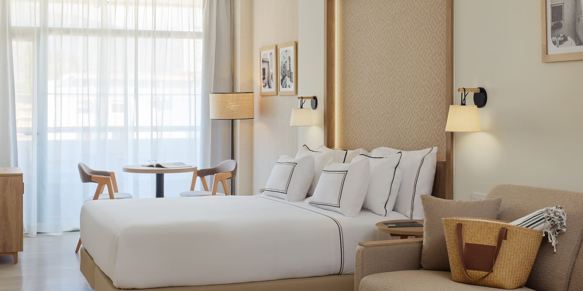 a hotel room with a bed and a chair