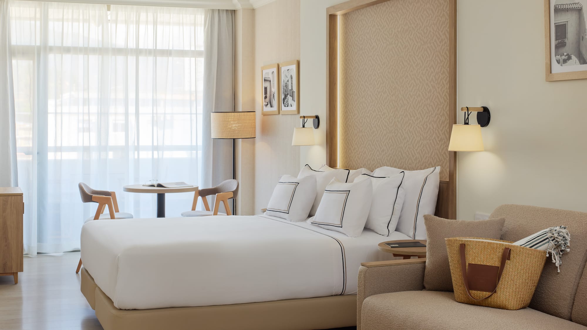 a hotel room with a bed and a chair