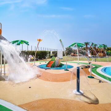 a water park with a water slide and a pool