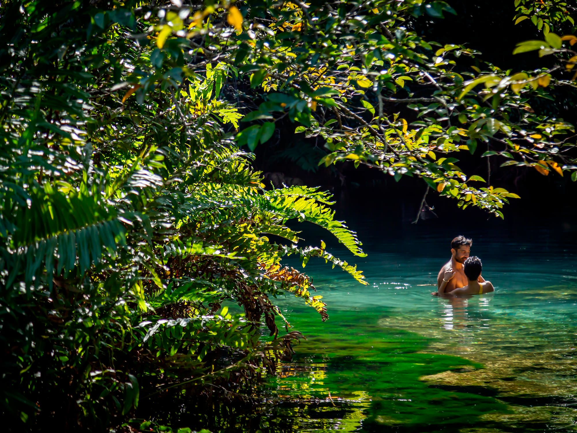 a man and woman in water